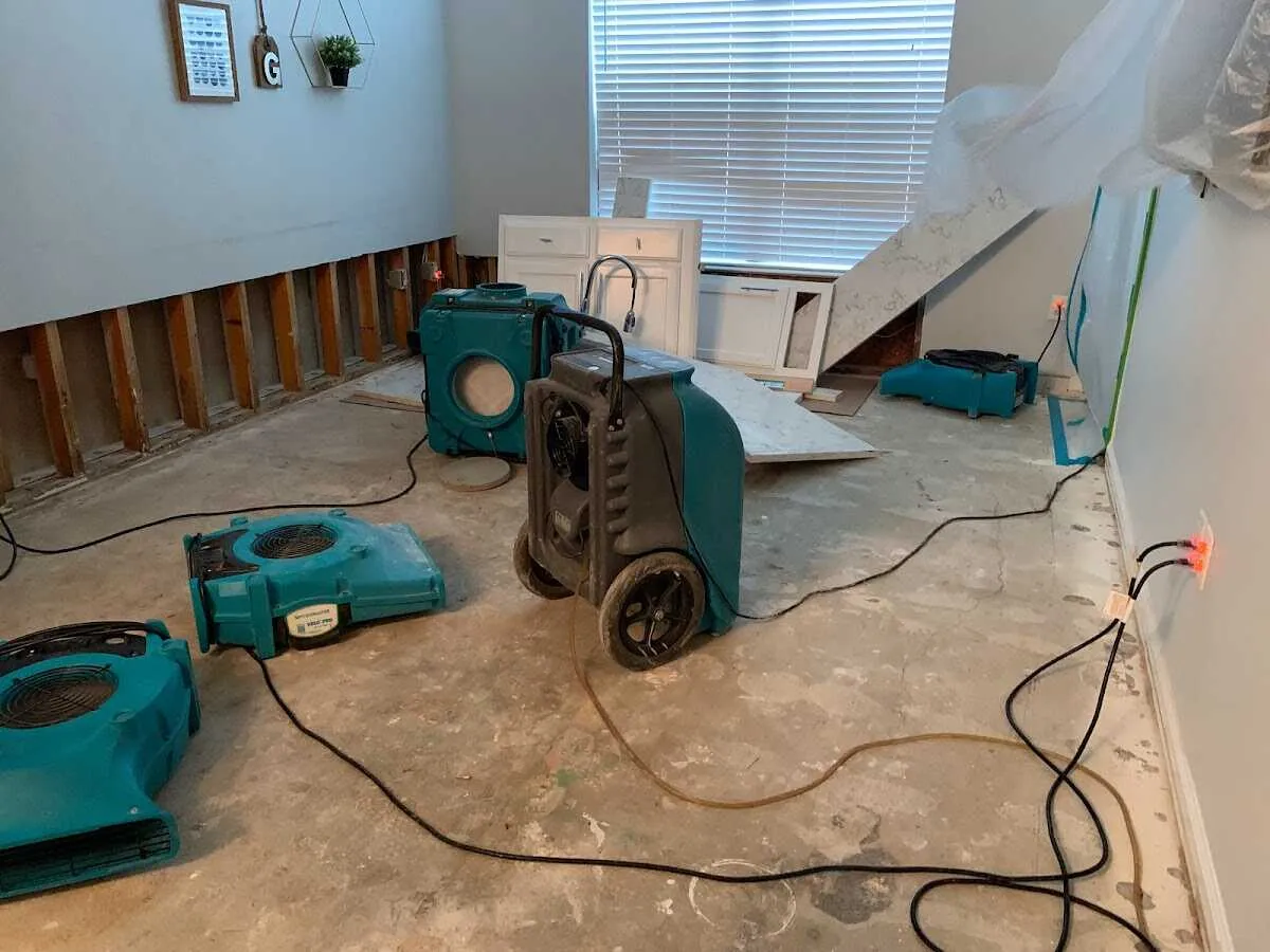 Dehumidifier in flood-cut room for Water Damage Restoration in New River